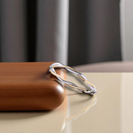 9K White & Yellow Gold Twist Hinged Bangle - Pobjoy Diamonds