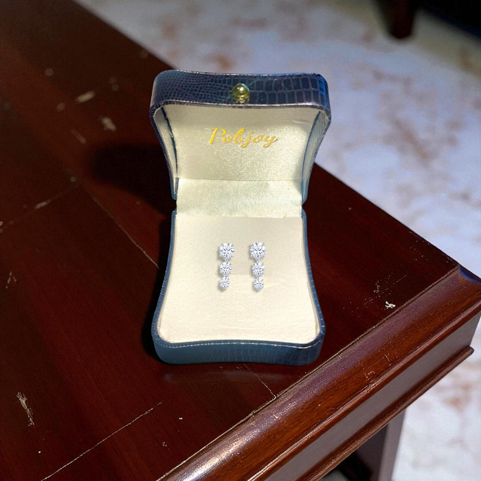 Three stone diamond drop earrings GIA certified.