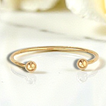 Hollow 9K Gold Baby Torque Bangle. Pobjoy Diamonds