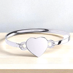 Solid Sterling Silver Baby Heart Motif Bangle. Pobjoy Diamonds