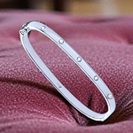 White Gold Ladies Studded Diamond Oval Bangle 0.20 Carat - Pobjoy Diamonds