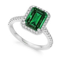 Load image into Gallery viewer, 950 Platinum Emerald Cut Emerald &amp; Diamond Halo Ring 2.25 CTW - Pobjoy Diamonds